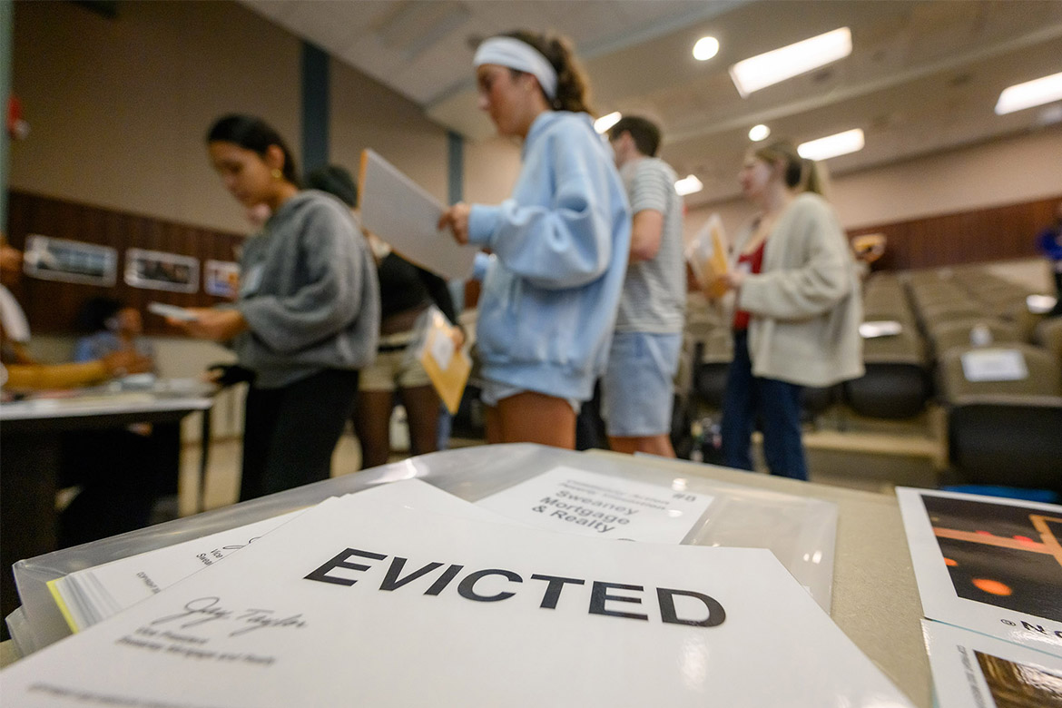 Students learn about poverty through a simulation.
