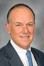Stephen Smith, chairman, Board of Trustees, smiling.