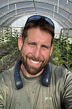 Christopher Hall in the greenhouse.
