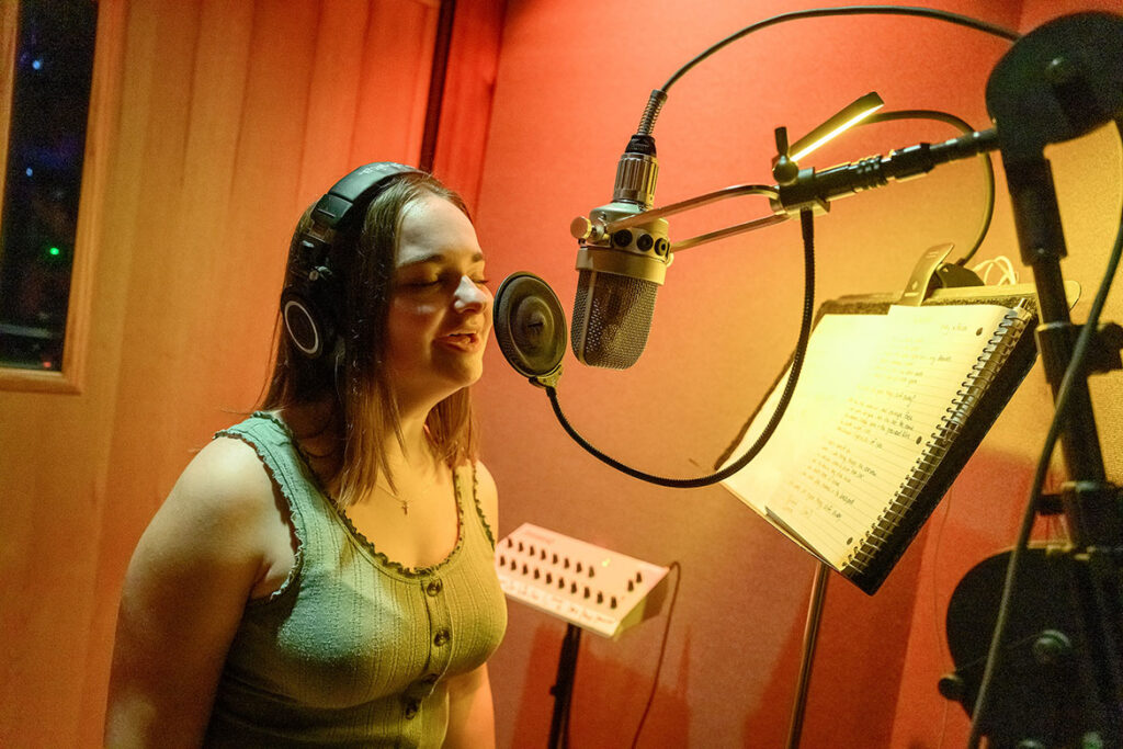 Anica Meyerhoff, a senior commercial songwriting student in the Department of Recording Industry at Middle Tennessee State University in Murfreesboro, Tenn., sings a song she co-wrote during a recording session at Curb Studios in Nashville, Tenn., on April 10, 2026. (MTSU photo by Cat Curtis Murphy)