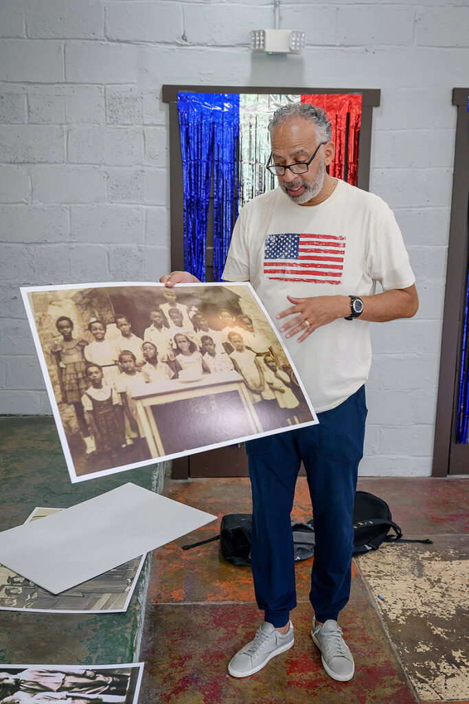 The Rev. Vincent Windrow, an alumnus and retired administrator at Middle Tennessee State University in Murfreesboro, Tenn., explains the backstory of enlarged historic photos that will be on display inside the newly restored and reopened Cemetery School, located off Old Nashville Highway just outside Murfreesboro. The school was once the heart of a thriving Black community that emerged after the Civil War, founded by formerly enslaved Union Army veterans. (MTSU photo by Andy Heidt)