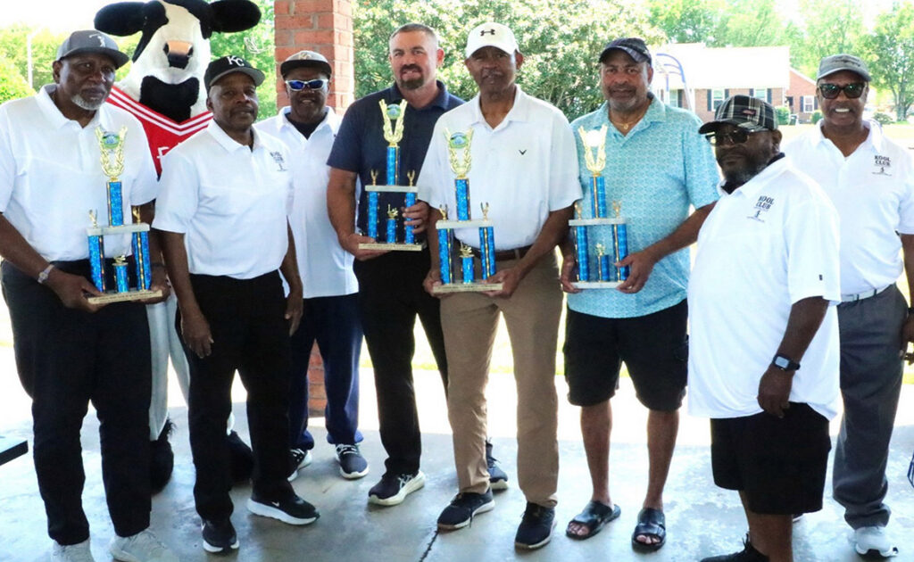 Pictured from left, holding their trophies, are Alvin Boyd, Chris Henderson, Ken Moore and Byron Thomas, first-place winners of the KOOL Club’s second Kenneth L. Toney Golf Tournament held in mid-May at Indian Hills Golf Course in Murfreesboro, Tenn. Also pictured, from left, are Ed Cooper, club vice president, club founders Edd Hill and Collier Woods, and KOOL Club President Tony Grimes. The tournament funds an annual scholarship to a qualifying Middle Tennessee State University student. At back left is the mascot for tournament food sponsor Chick-fil-A. (Submitted photo)