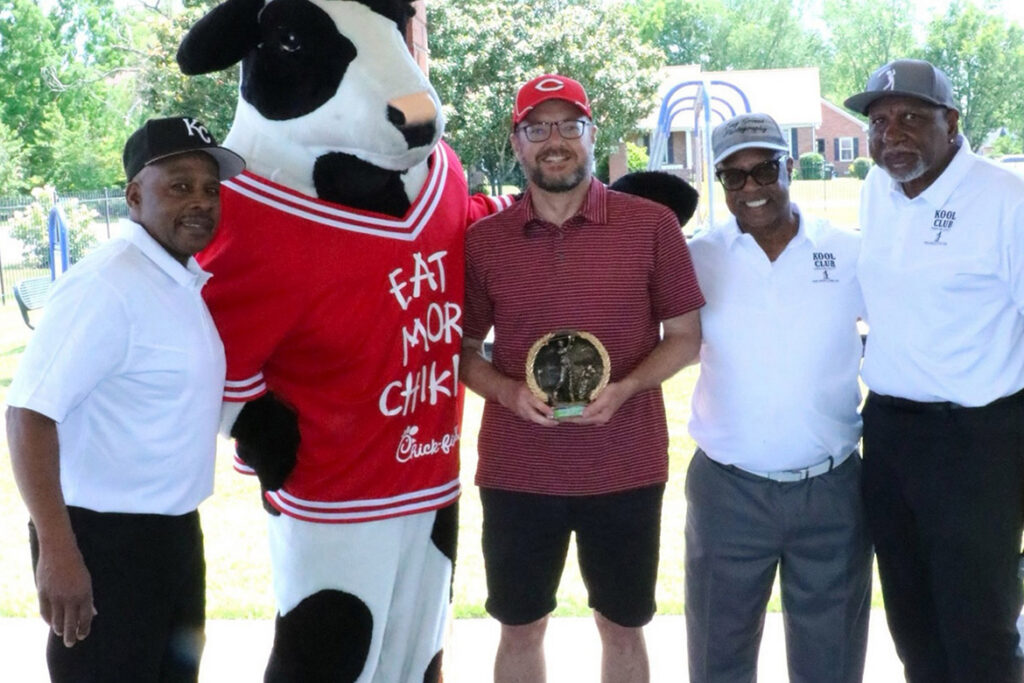 Chris Riggs, center, holds the plaque for Longest Drive in the men’s division of the KOOL Club’s second Kenneth L. Toney Golf Tournament held in mid-May at Indian Hills Golf Course in Murfreesboro, Tenn. Also pictured, from left, are KOOL Club members Ed Cooper, Tony Grimes and Alvin Boyd, along with the mascot for tournament food sponsor Chick-fil-A, second from left. (Submitted photo)