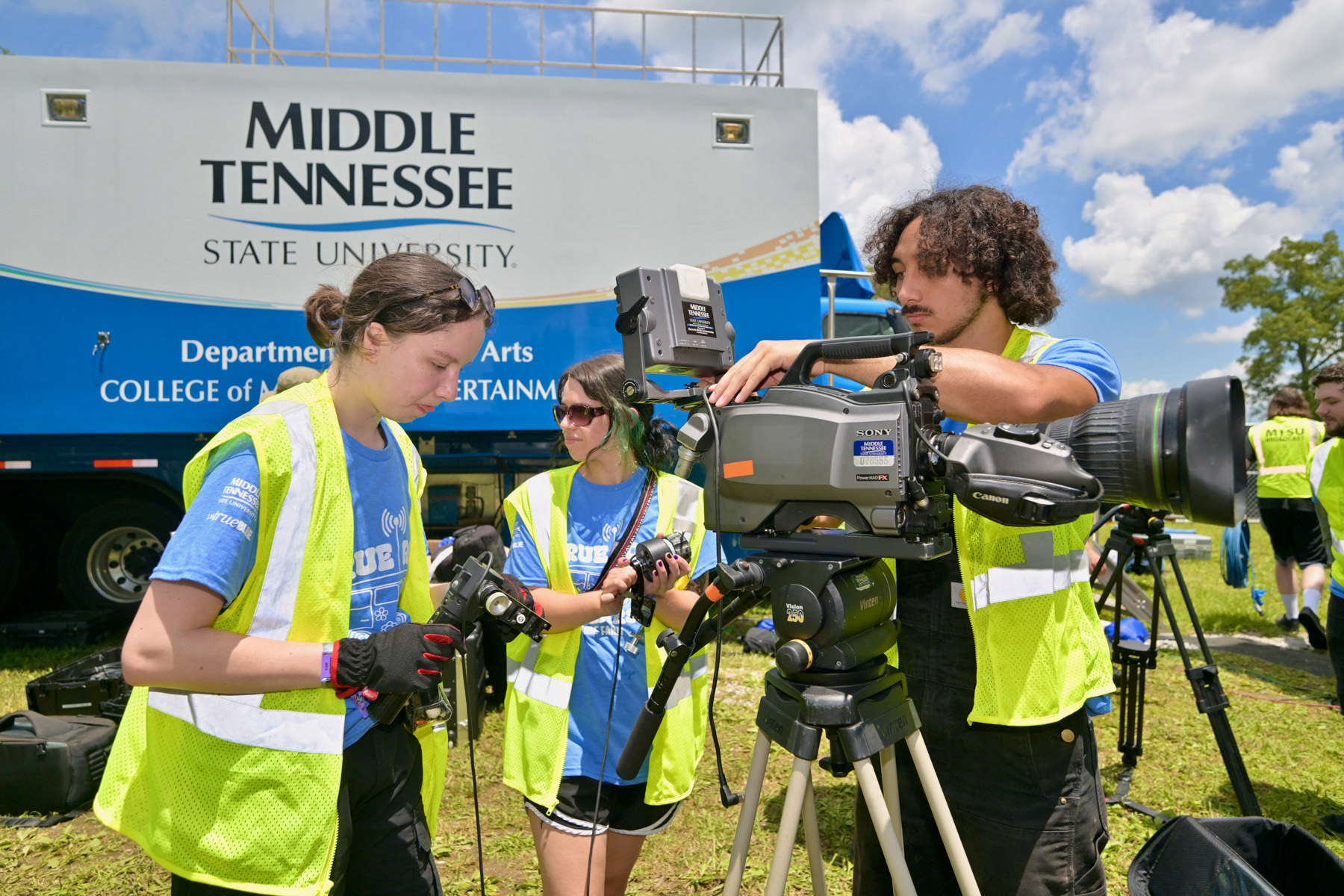 Students from the Media Arts Department at Middle Tennessee State University in Murfreesboro, Tenn., unload and prepare audiovisual equipment outside the university’s Mobile Production Lab on site at Bonnaroo.