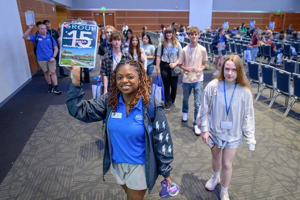 Middle Tennessee State University New to Blue Orientation guides lead incoming students out of the Student Union Ballroom for a whirlwind tour during the session held May 27 on campus in Murfreesboro, Tenn. All incoming students must complete New to Blue in order to be advised and register for fall semester classes, which kick off Monday, Aug. 24. (MTSU photo by J. Intintoli)