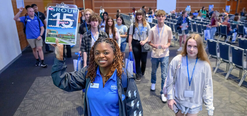 Middle Tennessee State University New to Blue Orientation guides lead incoming students out of the Student Union Ballroom for a whirlwind tour during the session held May 27 on campus in Murfreesboro, Tenn. All incoming students must complete New to Blue in order to be advised and register for fall semester classes, which kick off Monday, Aug. 24. (MTSU photo by J. Intintoli)