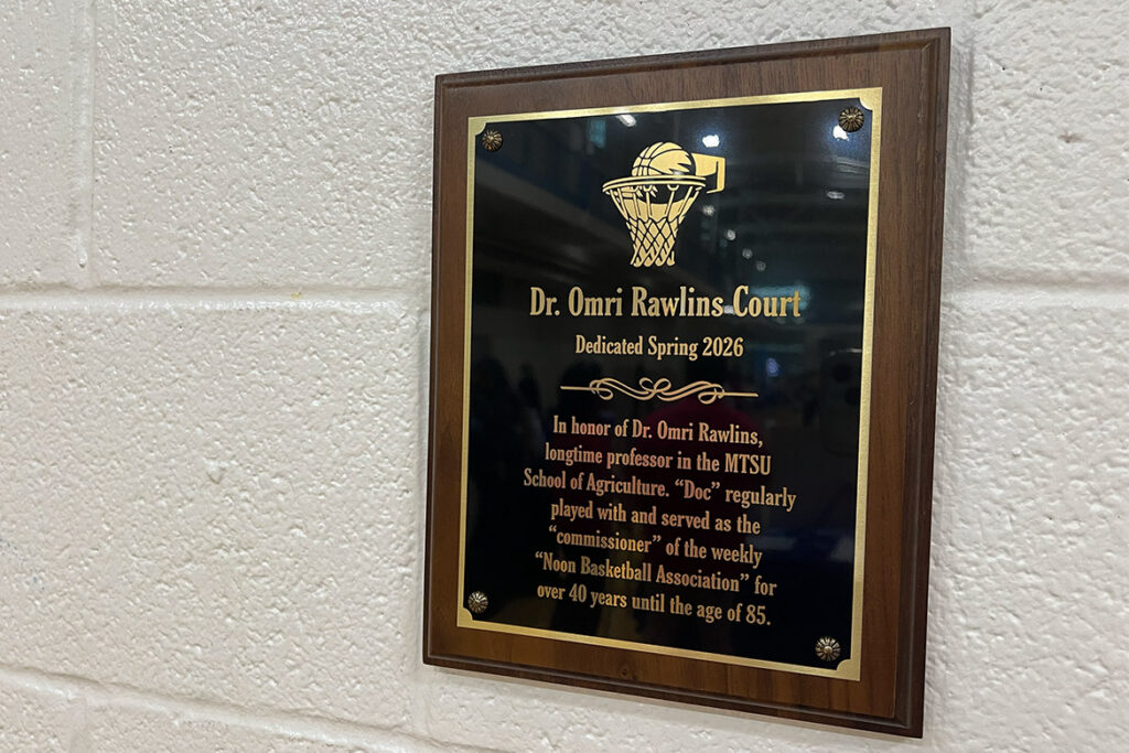 A plaque marking the dedication of "Dr. Omri Rawlins Court" hangs inside the Middle Tennessee State University Campus Recreation Center in Murfreesboro, Tenn. The honor recognizes Rawlins' more than 40 years of participation in the “Noon Basketball Association” comprised of faculty and staff and his role as the group's longtime "commissioner." (MTSU photo by Karli Sutton)