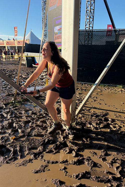 Middle Tennessee State University in Murfreesboro, Tenn., journalism student Zoe Kuhn experiences the muddy conditions at the Bonnaroo Music and Arts Festival held June 11-14, 2026, in Manchester, Tenn., where she produced content for the university’s student-run media outlet Sidelines. (MTSU photo)