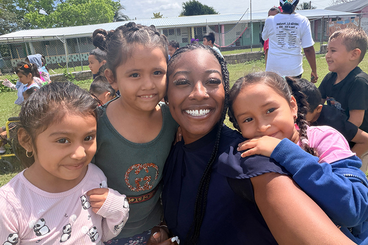 Autumn Claybrooks, second from right, a spring elementary education graduate from Middle Tennessee State University, poses with some of her students during her student-teaching residency in Belize in spring 2026. (Submitted photo).