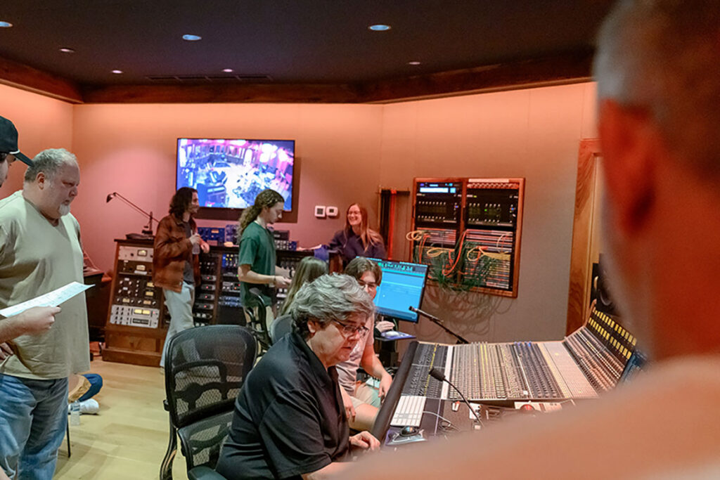 Students in the commercial songwriting and MFA recording arts and technologies programs at Middle Tennessee State University in Murfreesboro, Tenn., spend time at Curb Studios in Nashville, Tenn., on April 10, 2026, where they had the opportunity to record music and work with professional musicians, alongside their professors Odie Blackmon, standing, left, and Bill Crabtree, seated foreground, at control panel. (MTSU photo by Cat Curtis Murphy)