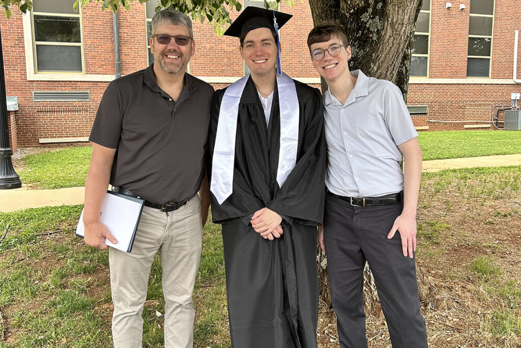 Shown here in his academic regalia on the Middle Tennessee State University campus in Murfreesboro, Tenn., spring 2026 MTSU graduate Tristan Howard, center, has been selected as a coordinator for international relations with the highly competitive Japan Exchange and Teaching Program, only the second MTSU student to be selected to such a position. (Submitted photo)