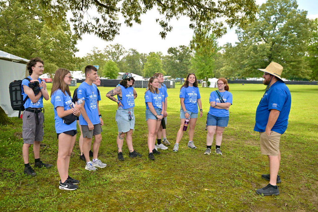 Matthew Leimkuehler, right, assistant journalism professor at Middle Tennessee State University in Murfreesboro, Tenn., gives instructions to the MTSU journalism students Wednesday, June 10, 2026, at the Bonnaroo Music and Arts Festival in Manchester, Tenn. Leimkuehler supervised the students working as part of the Seigenthaler News Service to write stories and take photos from the festival that will be shared with media outlets statewide. (MTSU photo by J. Intintoli)