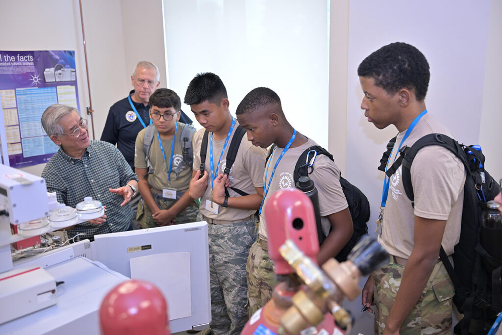 Ngee Sing Chong, left, chemistry professor at Middle Tennessee State University in Murfreesboro, Tenn., conducts a laboratory workshop on agricultural, bioanalytical, environmental, materials, and forensic analysis inside the Science Building for cadets in the U.S. Air Force Auxiliary’s National Cadet Engineering Technology Academy held July 18-25, 2026, on campus. (MTSU Photo by James Cessna)