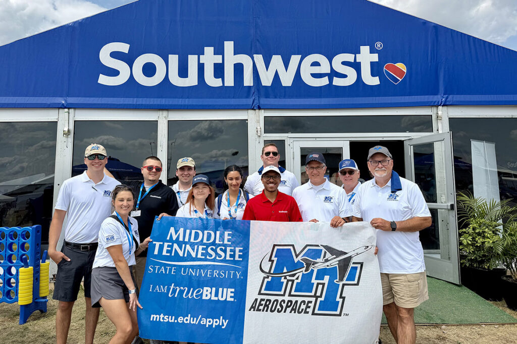 Students and faculty from Middle Tennessee State University in Murfreesboro, Tenn., visit with representatives of Southwest Airlines at the 2026 EAA AirVenture in Oshkosh, Wis. MTSU Aerospace and Southwest are partners in pilot training and hiring. (MTSU Photo by Andrew Oppmann)