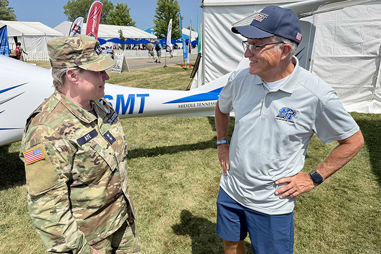 Maj. Gen. Regena Aye, left, national commander of Civil Air Patrol, the volunteer civilian auxiliary of the U.S. Air Force and partner with Middle Tennessee State University’s Aerospace Department since 2014, visits with MTSU Provost Mark Byrnes at the university’s tent at the 2026 EAA AirVenture in Oshkosh, Wis. (MTSU Photo by Andrew Oppmann)