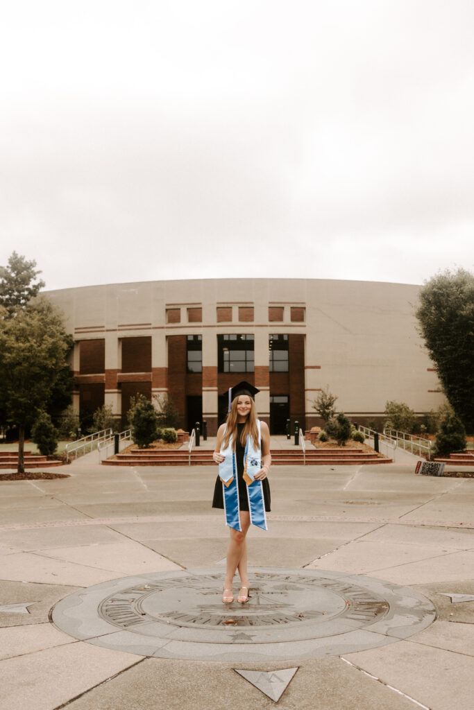 Ella Cobb stand on the seal on the campus of Middle Tennessee State University in Murfreesboro, Tenn. (Photo submitted)