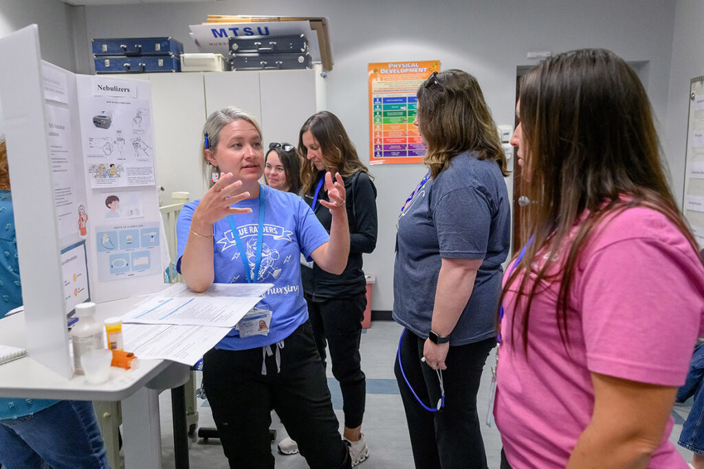 Julie Honey, left, clinical assistant professor of nursing at Middle Tennessee State University School of Nursing in Murfreesboro, Tenn., teaches best practices for using nebulizers for asthma patients during School Nurse Skills Day hosted in June in the Cason-Kennedy Nursing Building on campus. (MTSU photo by J. Intintoli)