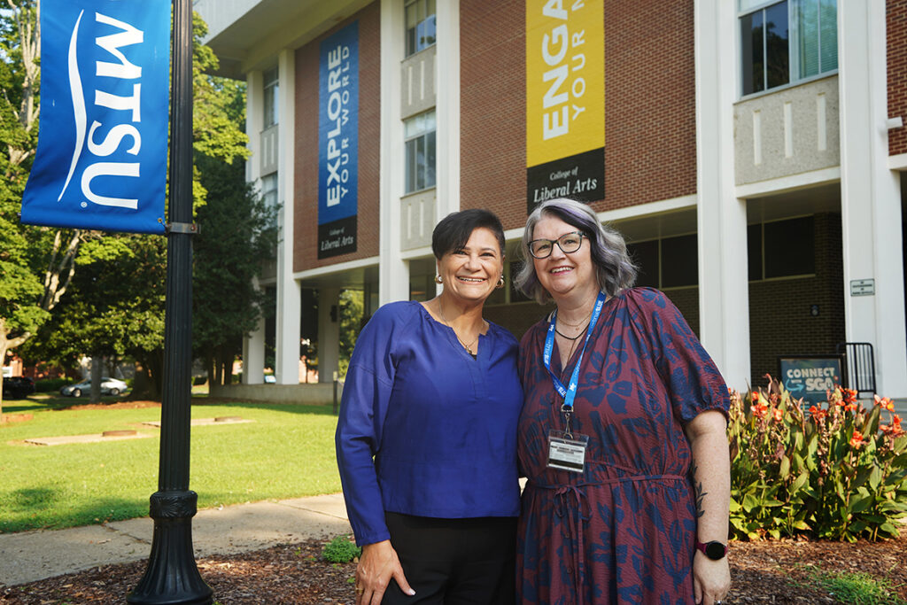 Rehab Ghazal, associate dean of the College of Liberal Arts and director of the Institute for Interdisciplinary Studies and Initiatives, left, and Jenn Dix, executive assistant, pose for a photo in front of Peck Hall on the campus of Middle Tennessee State University in Murfreesboro, Tenn. The newly established institute is located in Peck Hall Room 202 and will serve as the home for the university’s interdisciplinary minors while expanding opportunities for interdisciplinary teaching, research and community engagement. (MTSU photo by Mike Davis)