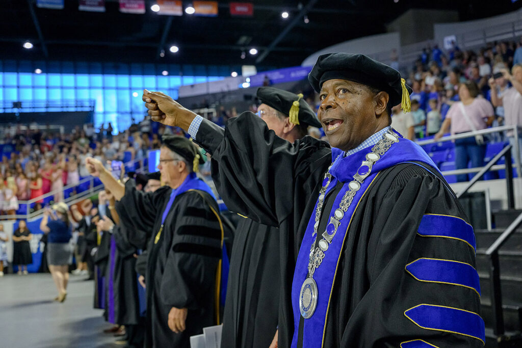 Middle Tennessee State University President Sidney A. McPhee participates in the singing of the university’s fight song during the 25th annual Convocation held Saturday, Aug. 22, inside Murphy Center on campus. Convocation formally welcomes the latest crop of scholars into the academic community, with McPhee, attending faculty, and top administrators wearing academic regalia. (MTSU photo by Andy Heidt)