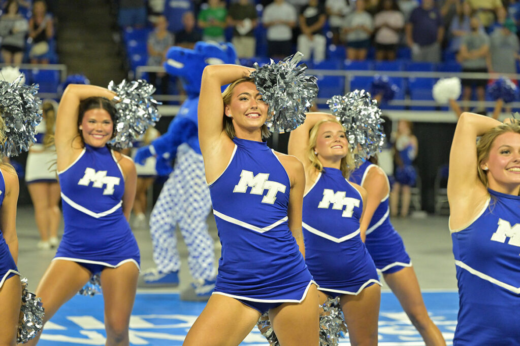 Middle Tennessee State University Cheer and Dance team members lead the crowd in singing of the university’s fight song during the 25th annual Convocation held Saturday, Aug. 22, inside Murphy Center on campus. (MTSU photo by James Cessna)