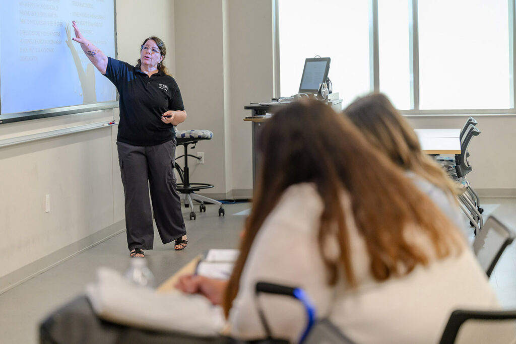 Elizabeth Q. Wright, criminal justice professor at Middle Tennessee State University in Murfreesboro, Tenn., leads a lesson in recognizing signs of domestic violence for one of the sessions in the fourth annual Criminal Justice High School Educators Professional Development Workshop, held in June on campus for high school Career and Technical Education teachers from across Tennessee. (MTSU photo by J. Intintoli)