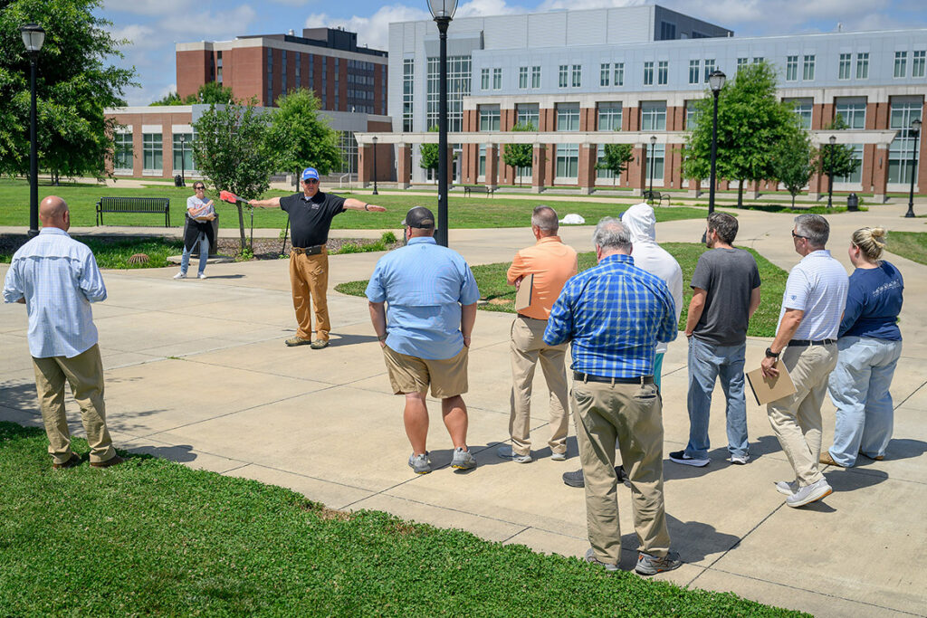 With arms stretched out, James Abbott,, a criminal justice lecturer at Middle Tennessee State University in Murfreesboro, Tenn., leads a session in crime scene investigation as part of the fourth annual Criminal Justice High School Educators Professional Development Workshop, held in June on campus for high school Career and Technical Education teachers from across Tennessee. (MTSU photo by J. Intintoli)