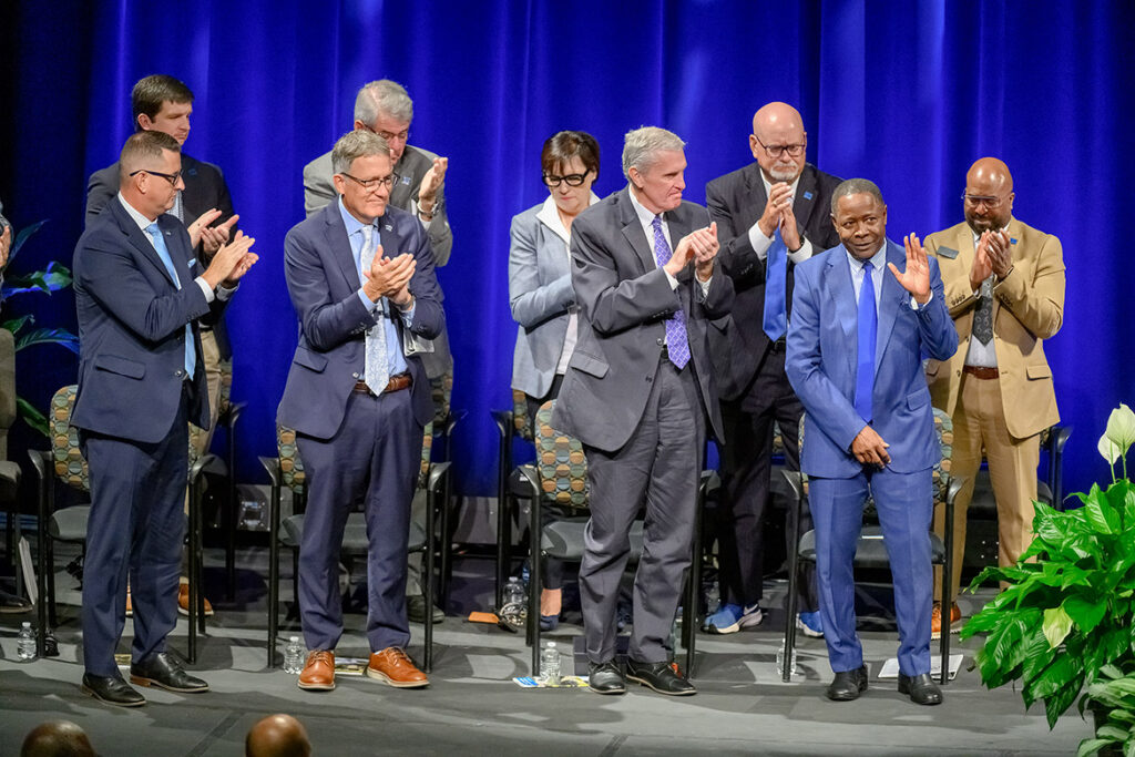 Middle Tennessee State University President Sidney A. McPhee, front row at right, receives an extended stand ovation after delivering his final State of the University Address Thursday, Aug. 20, 2026, during the university’s annual Fall Faculty Meeting inside Tucker Theatre to kick off the 2026-27 academic year on the Murfreesboro, Tenn., campus. McPhee will retire at the end of the year after almost 26 years leading the institution. (MTSU photo by J. Intintoli)