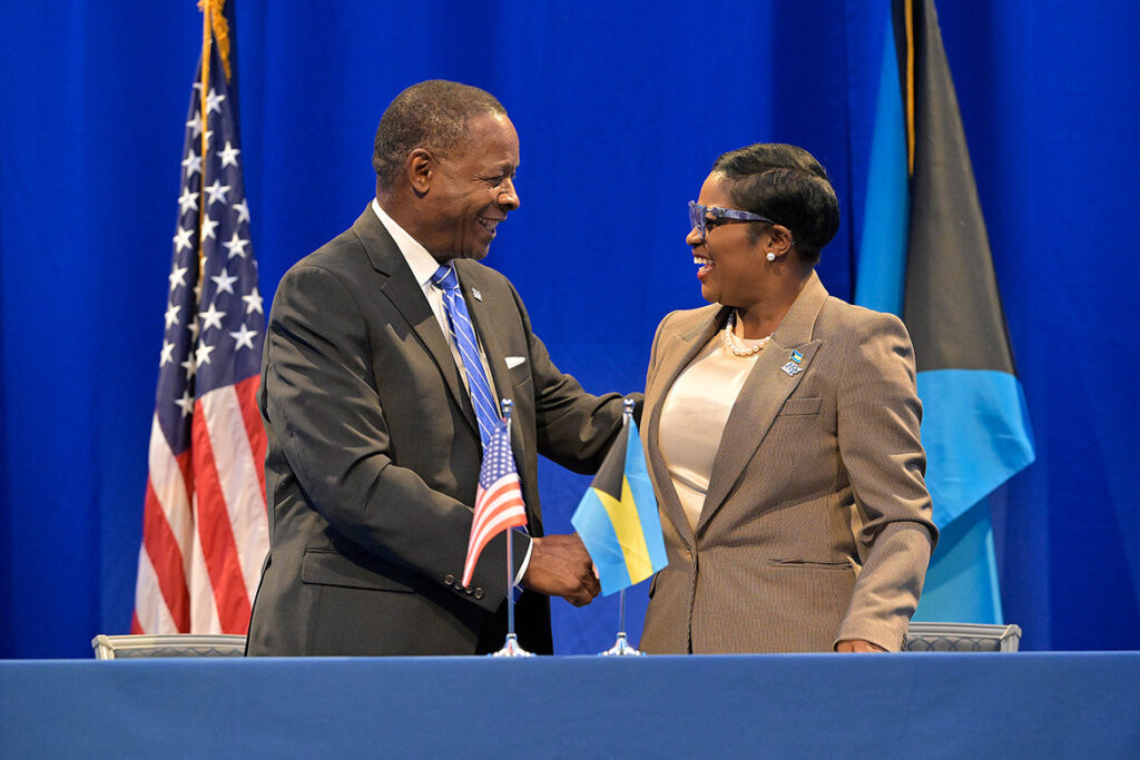 Middle Tennessee State University President Sidney A. McPhee, left, and JoBeth Coleby-Davis, minister of energy, utilities and aviation for the Bahamas, shake hands during a signing ceremony held Thursday, Aug. 13, 2026, in the MTSU Student Union Ballroom on campus in Murfreesboro, Tenn. The two leaders advanced an aerospace education agreement between the university and the commonwealth allowing Bahamian students to take aviation courses through the MTSU Aerospace Department. (MTSU photo by Andy Heidt)