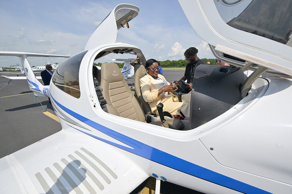 JoBeth Coleby-Davis, minister of energy, utilities and aviation for the Bahamas, sits in the cockpit of one of Middle Tennessee State University’s Diamond Aircraft at the Murfreesboro, Tenn., municipal airport on Wednesday, Aug. 12, 2026, during a tour by her and other members of her delegation of MTSU Aerospace facilities. The university and the commonwealth advanced a partnership to allow Bahamian students to take MTSU aviation courses. (MTSU photo by Andy Heidt)