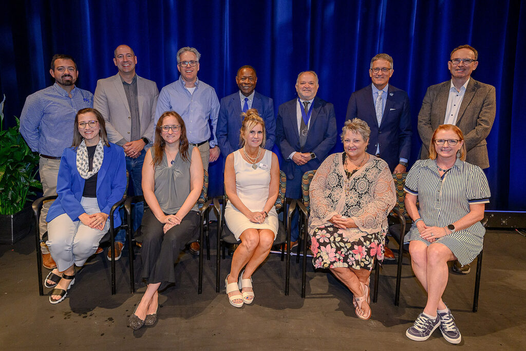 Middle Tennessee State University faculty and staff gather for a group photo with university leaders Thursday, Aug. 20, after they were recognized by the MTSU Foundation with awards for their service at the 2026 Fall Faculty and Staff Meeting in Tucker Theatre. Recipients and their honors include, front row, from left, Sheri Selph, Distinguished Senior Career Creative Activity Award; Jessica Arbour, Distinguished Early Career Research Award; Cynthia Chafin, Outstanding Public Service Award; Candie Moonshower, Outstanding Teaching in True Blue Core; and Bonnie Barksdale, Outstanding Teaching Award; and back row from left, Collin McDonald, Distinguished Early Career Creative Award; Andrew Polk, Outstanding Teaching Award; Scott McDaniel, Outstanding Teaching Award; President Sidney A. McPhee; Lalo Davila, Career Achievement Award; Provost Mark Byrnes; and Christoph Rosenmüller, Distinguished Senior Research Award. Other winners not pictured are Sam Zaza and Mei Han, both recipients of Outstanding Public Service Awards; Rodrigo Gómez Claros, Distinguished Senior Career Creative Activity Award; and Ying “Iris” Gao, Distinguished Senior Research Award. (MTSU photo by Andy Heidt)