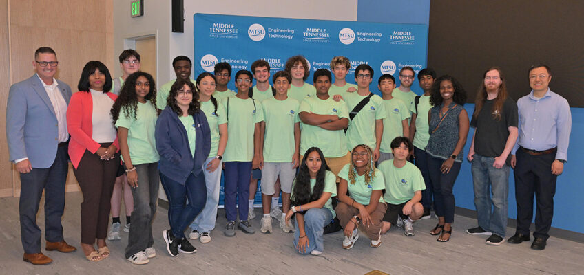 The cohort of 15 rising ninth through 12th graders who participated in the third annual National Summer Transportation Institute hosted by Middle Tennessee State University in Murfreesboro, Tenn., pose for a group photo with representatives from MTSU and the Tennessee Department of Transportation following the institute’s closing ceremony on July 31, 2026, in the Applied Engineering Building on campus. (MTSU photo by James Cessna)