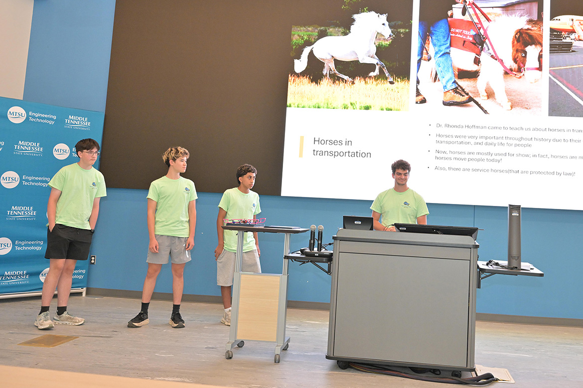 Four rising ninth through 12th graders who participated in the third annual National Summer Transportation Institute hosted by Middle Tennessee State University in Murfreesboro, Tenn., give a presentation at the institute’s closing ceremony on July 31, 2026, in the Applied Engineering Building on campus. (MTSU photo by James Cessna)