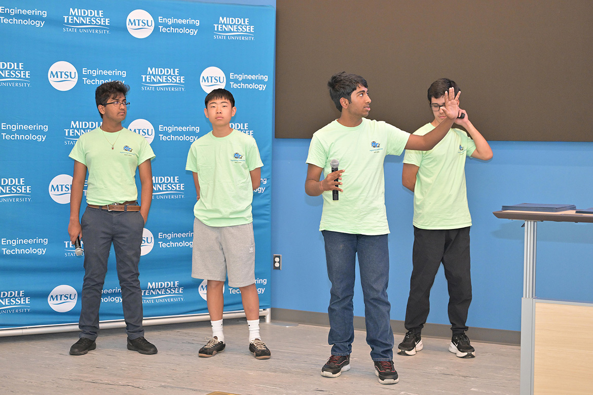 Four rising ninth through 12th graders who participated in the third annual National Summer Transportation Institute hosted by Middle Tennessee State University in Murfreesboro, Tenn., give a presentation at the institute’s closing ceremony on July 31, 2026, in the Applied Engineering Building on campus. (MTSU photo by James Cessna)