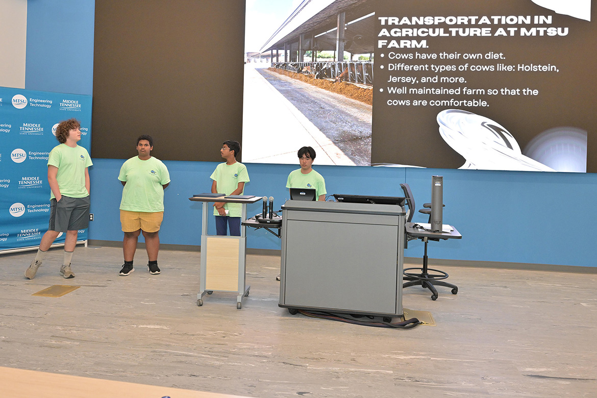 Four rising ninth through 12th graders who participated in the third annual National Summer Transportation Institute hosted by Middle Tennessee State University in Murfreesboro, Tenn., give a presentation at the institute’s closing ceremony on July 31, 2026, in the Applied Engineering Building on campus. (MTSU photo by James Cessna)