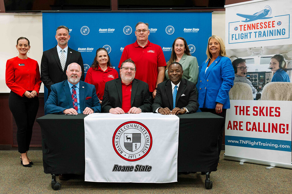 Roane State, Middle Tennessee State University, and Tennessee Flight Training representatives pause for a photo during an articulation agreement signing on Aug. 6, 2026, at Roane State's Cumberland County Campus in Harriman, Tenn. Seated front row, from left, are RSCC President Chris Whaley, Tennessee Flight Training President Chris Erlanson, and MTSU President Sidney A. McPhee. (Courtesy of Roane State Community College)