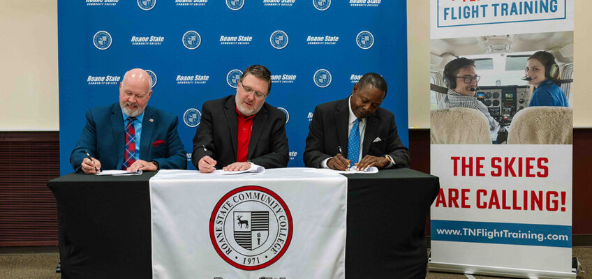 From left, Roane State Community College President Chris Whaley, Tennessee Flight Training President Chris Erlanson, and Middle Tennessee State University President Sidney A. McPhee sign an articulation agreement on Aug. 6, 2026, at Roane’s campus in Harriman, Tenn. The agreement supports streamlined transfer opportunities for students pursuing two of the community college’s newest offerings — aerospace and fire science. (Courtesy of Roane State Community College)