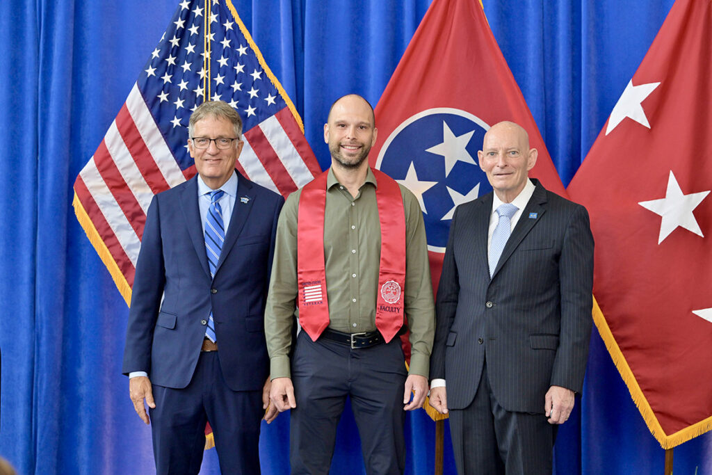 Middle Tennessee State University Provost Mark Byrnes, left, and retired Lt. Gen. Keith M. Huber, senior adviser for veterans and leadership initiatives at MTSU, right, stand with U.S. Marine veteran James Copeland following the Charlie and Hazel Daniels Veterans and Military Family Center’s 34th Graduating Veterans Stole Ceremony held Thursday, Aug. 6, at Miller Education Center on campus in Murfreesboro, Tenn. Copeland, interim assistance vice president of client services on campus and director of classroom technology at MTSU, turned to the Daniels Center for assistance last year after he was diagnosed with cancer. (MTSU photo by Andy Heidt)