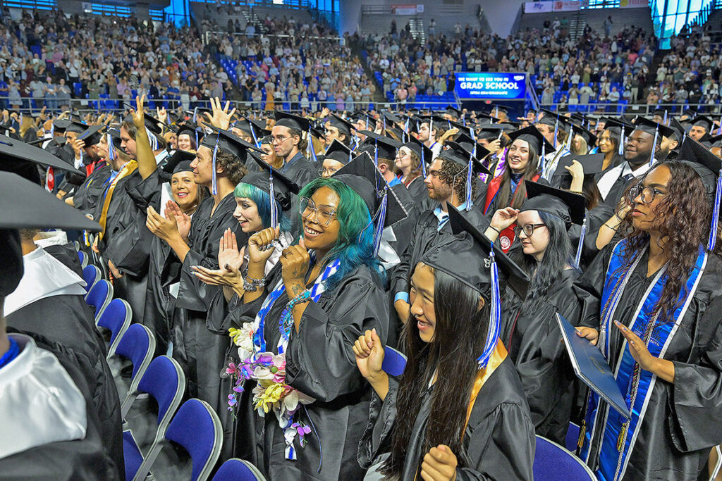 Middle Tennessee State University Class of 2026 graduates cheer following the completion of the summer commencement ceremony held Saturday, Aug. 8, 2026, inside Murphy Center on campus in Murfreesboro, Tenn. (MTSU photo by Andy Heidt)