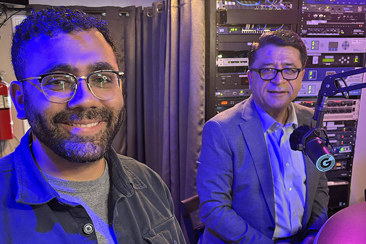 Dr. Murat Arik, right, director of the MTSU Business and Economic Research Center, and Bishoy Mikhail, vice president of research for the Nashville Area Chamber of Commerce, ready for a July 20 interview in WGNS Radio’s downtown Murfreesboro, Tenn., studio. (MTSU photo by Nancy DeGennaro)