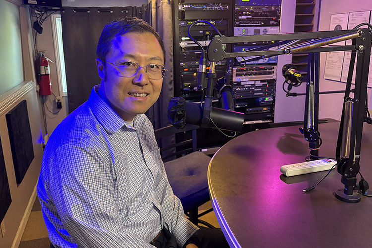 Dr. Lei Miao, professor of mechatronics engineering at MTSU, readies for a July 20 interview in WGNS Radio’s downtown Murfreesboro, Tenn., studio. (MTSU photo by Nancy DeGennaro)