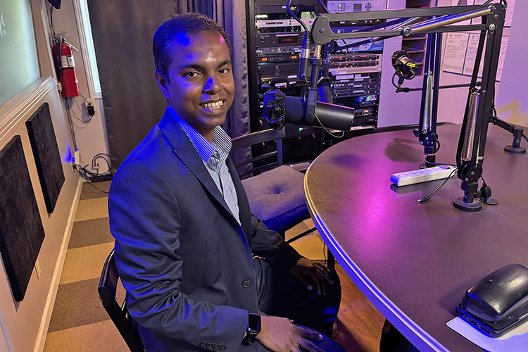 Dr. Vajira Manathunga, director of MTSU’s Actuarial Science Program and associate professor of the Department of Mathematical Sciences, readies for a July 20 interview in WGNS Radio’s downtown Murfreesboro, Tenn., studio. (MTSU photo by Nancy DeGennaro)