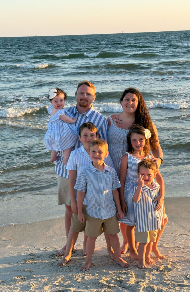 Adult learner, veteran and first-generation college graduate Dillon Matthews is seen here on the beach in an undated family vacation photo with his wife, Courtney Matthews, and their five children. (Photo submitted)