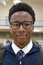 Brandon Cook, finance major, wearing blue tie with white shirt and blue vest.