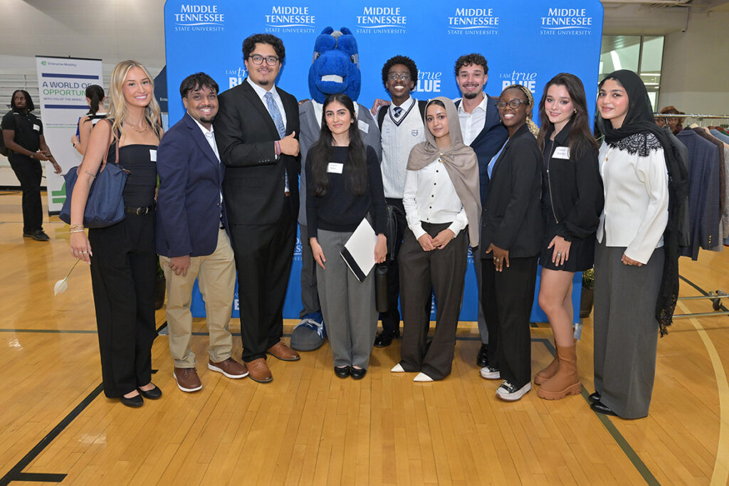 Dressed to impress, students at Middle Tennessee State University in Murfreesboro, Tenn., pose with mascot Lightning for a group photo before spreading out to visit their choices among the recruitment tables of 170 employers and graduate programs that sent representatives to the annual Big Career Fair on Thursday, Sept. 24, 2026, in the Campus Recreation Center. (MTSU photo by James Cessna)