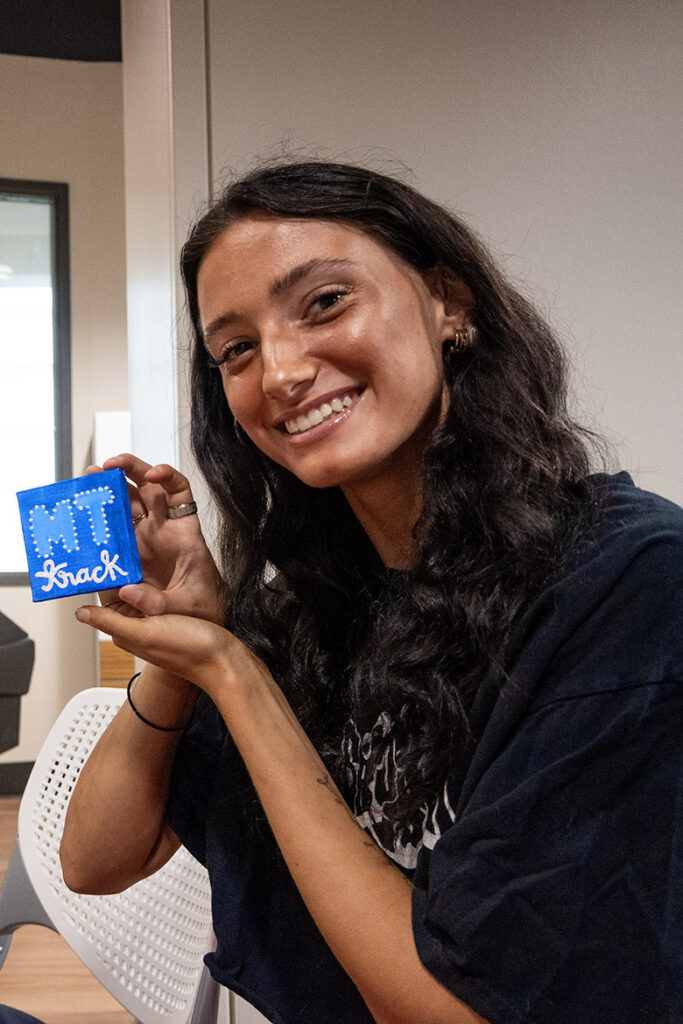 She’s a painter, she’s a track star — Middle Tennessee State University senior and runner Emma Benzinger holds up her tiny canvas, which she painted to represent MTSU’s track team. The agribusiness student took a break from studying to join her mom, fellow student Lisa Benzinger, in checking out the Student Union Building’s recently opened Craft Center in Murfreesboro, Tennessee. (MTSU photo by Cat Curtis Murphy)