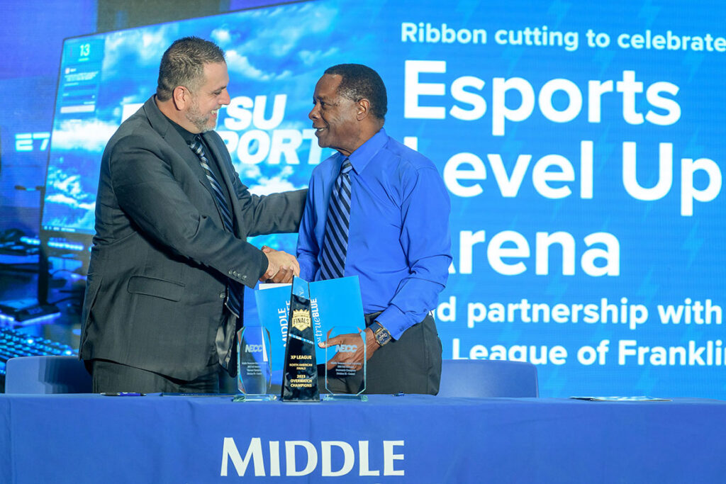 Middle Tennessee State University President Sidney A. McPhee shakes hands with XP League of Franklin Co-Founder Alex Rieffel during a ribbon-cutting and partnership signing ceremony on Tuesday, Sept. 22, 2026, in the Student Union Building atrium celebrating the expanded Esports Level Up Arena on the building’s first floor on the Murfreesboro, Tenn., campus, and the partnership between MTSU and the XP League involving the sharing of league professional coaching and university competitive gaming space. (MTSU Photo by J. Intintoli)