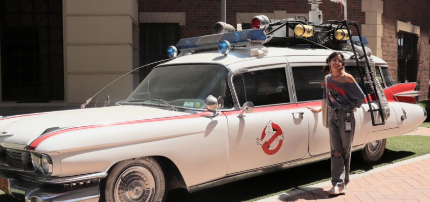 Jazz Suarez, a senior animation major at Middle Tennessee State University in Murfreesboro, Tenn., stands beside the iconic car from the “Ghostbusters” franchise during her internship at Sony Pictures Animation in Los Angeles, Calif., over the summer. (Submitted photo)