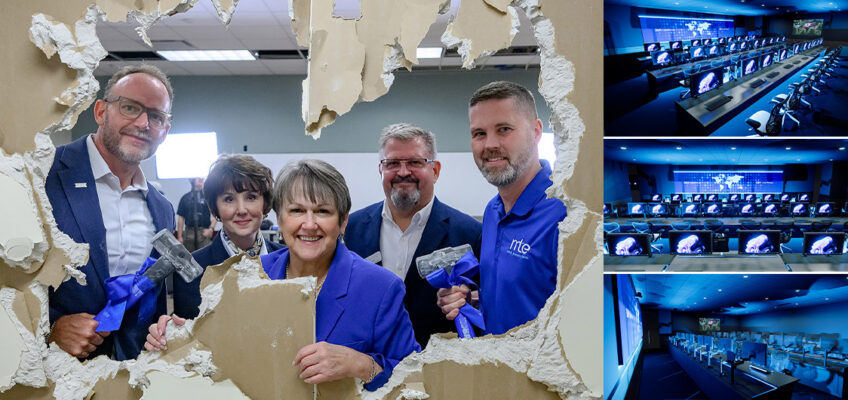 Five people smiling standing behind large hole in wall with three artist renderings of computer lab to the right.