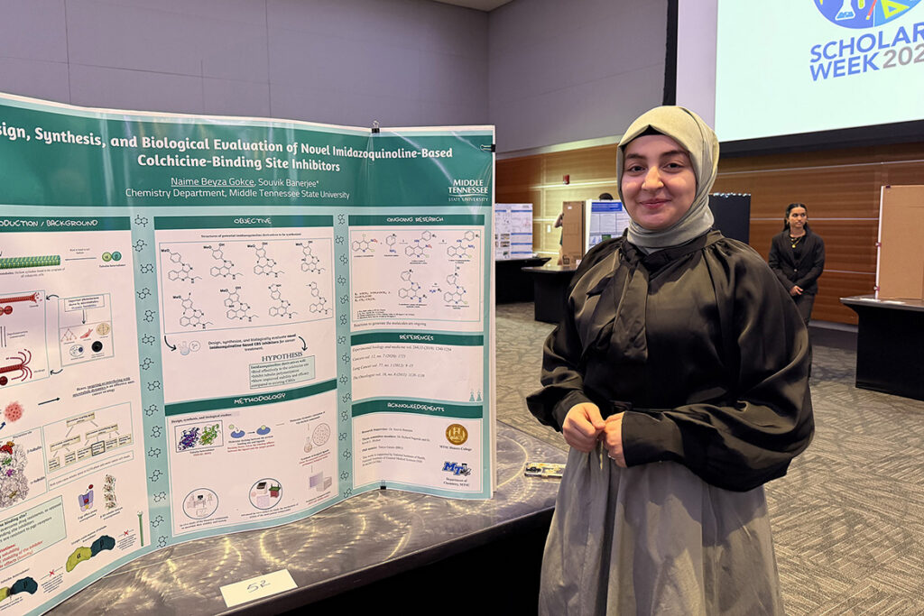 In this undated photo, Naime Gokce, a biochemistry major at Middle Tennessee State University in Murfreesboro, stands next to her research poster presentation during a previous Scholars Week event held in the Student Union Building. (MTSU photo by Robin E. Lee)