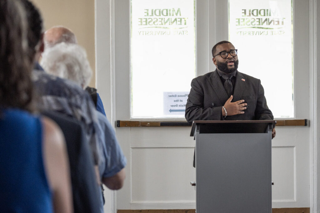 Michai Mosby, strategic marketing and communications specialist for Student Affairs at Middle Tennessee State University, sings the national anthem during the Veterans Memorial Service inside the Tom Jackson Building ahead of the Joe Nunley Distinguished Veteran Award presentation and Salute to Veterans and Armed Forces football game on Sept. 19, 2026, in Murfreesboro, Tenn. (MTSU Photo by Cat Curtis Murphy)